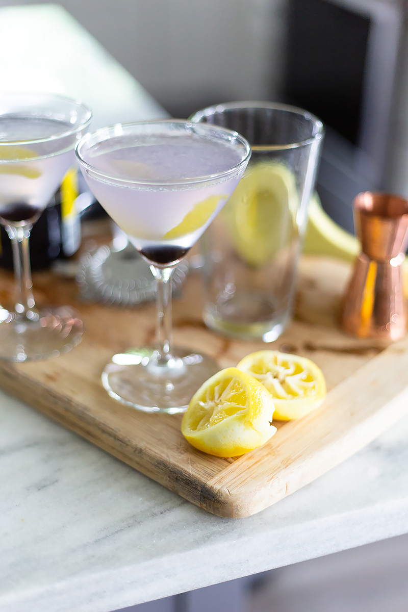 two aviation cocktails on a table.