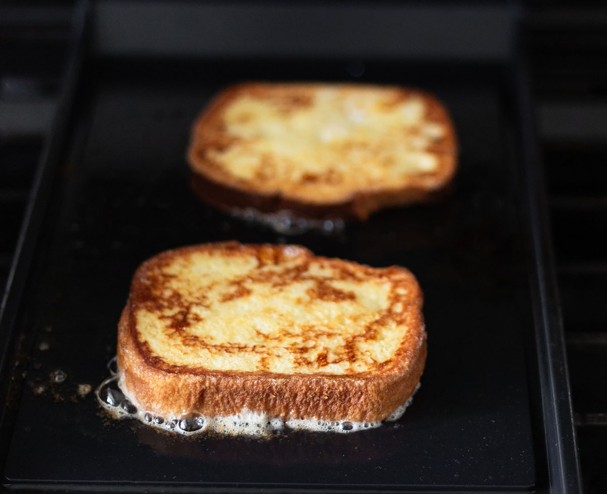 making french toast on a griddle.