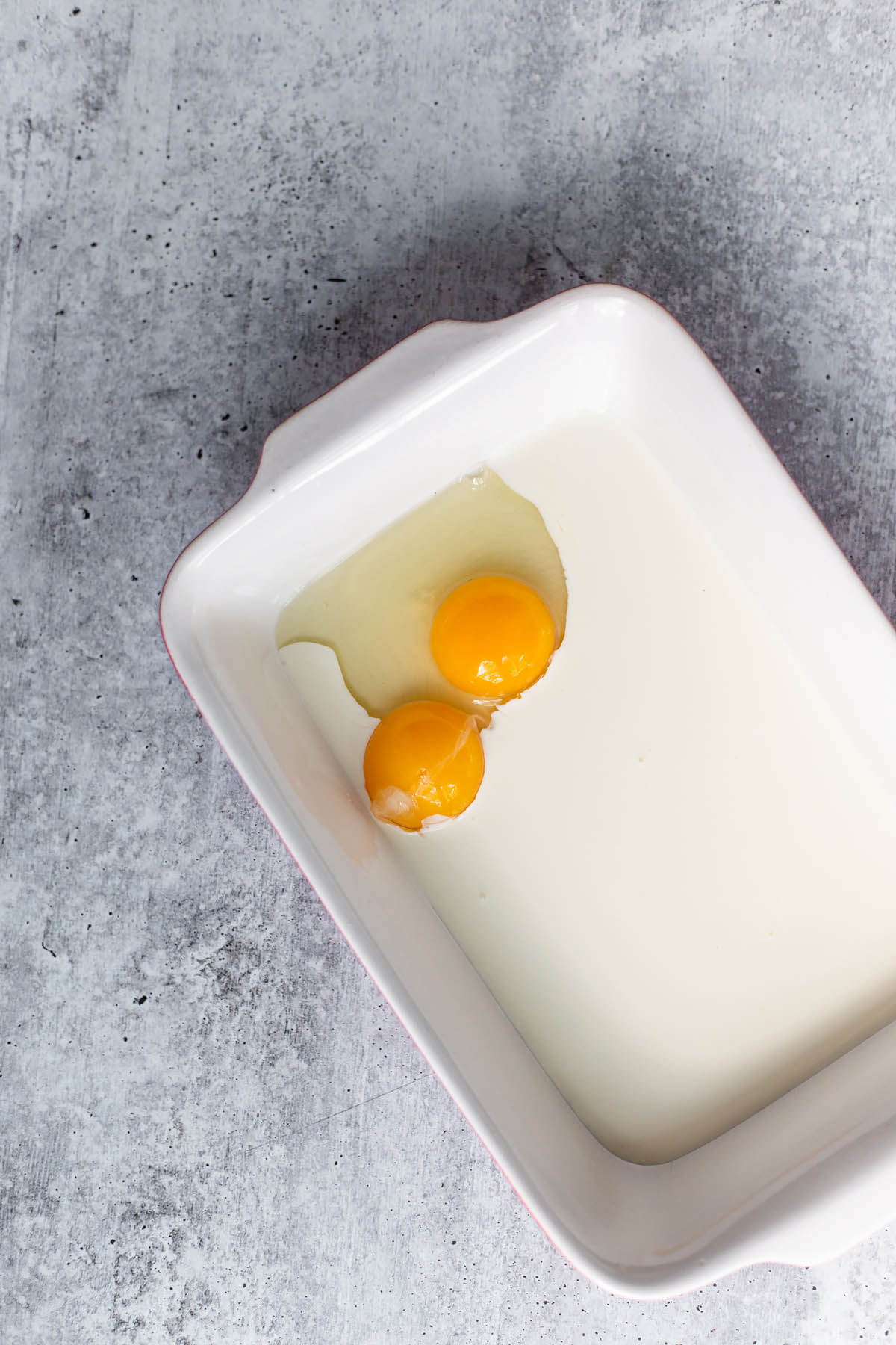 eggs and milk in a dish.