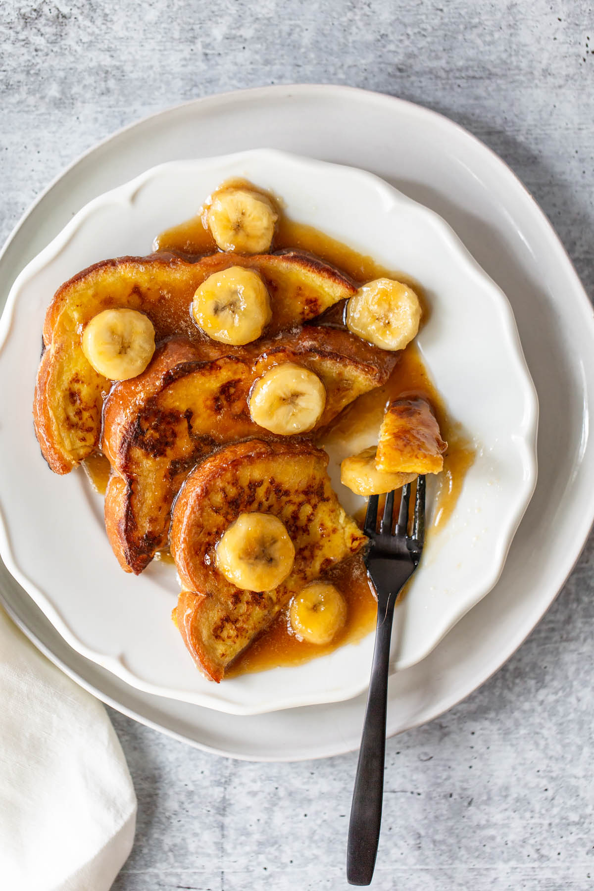 french toast with a bite on a fork.