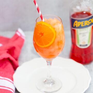 frozen aperol spritz with a bottle of aperol