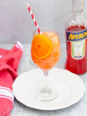 frozen aperol spritz with a bottle of aperol