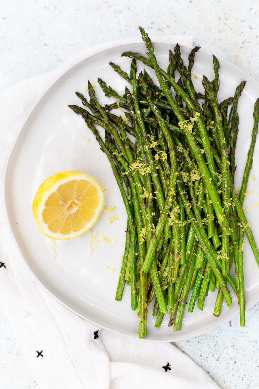 Roasted Asparagus with Lemon Zest and a lemon on the side