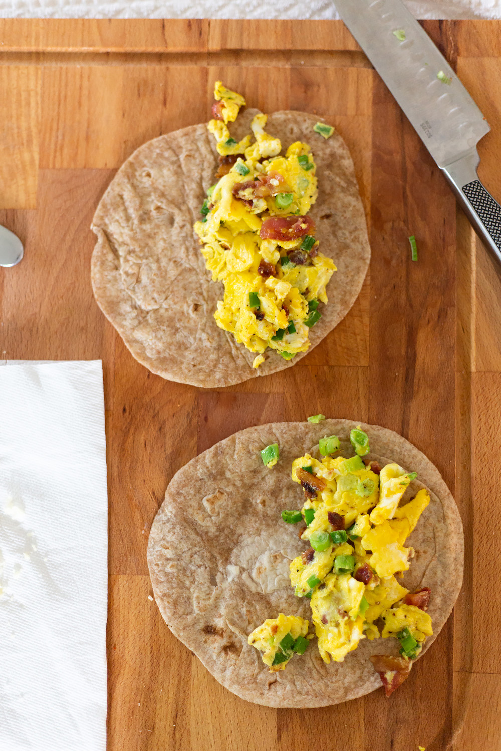 assembling breakfast quesadillas.