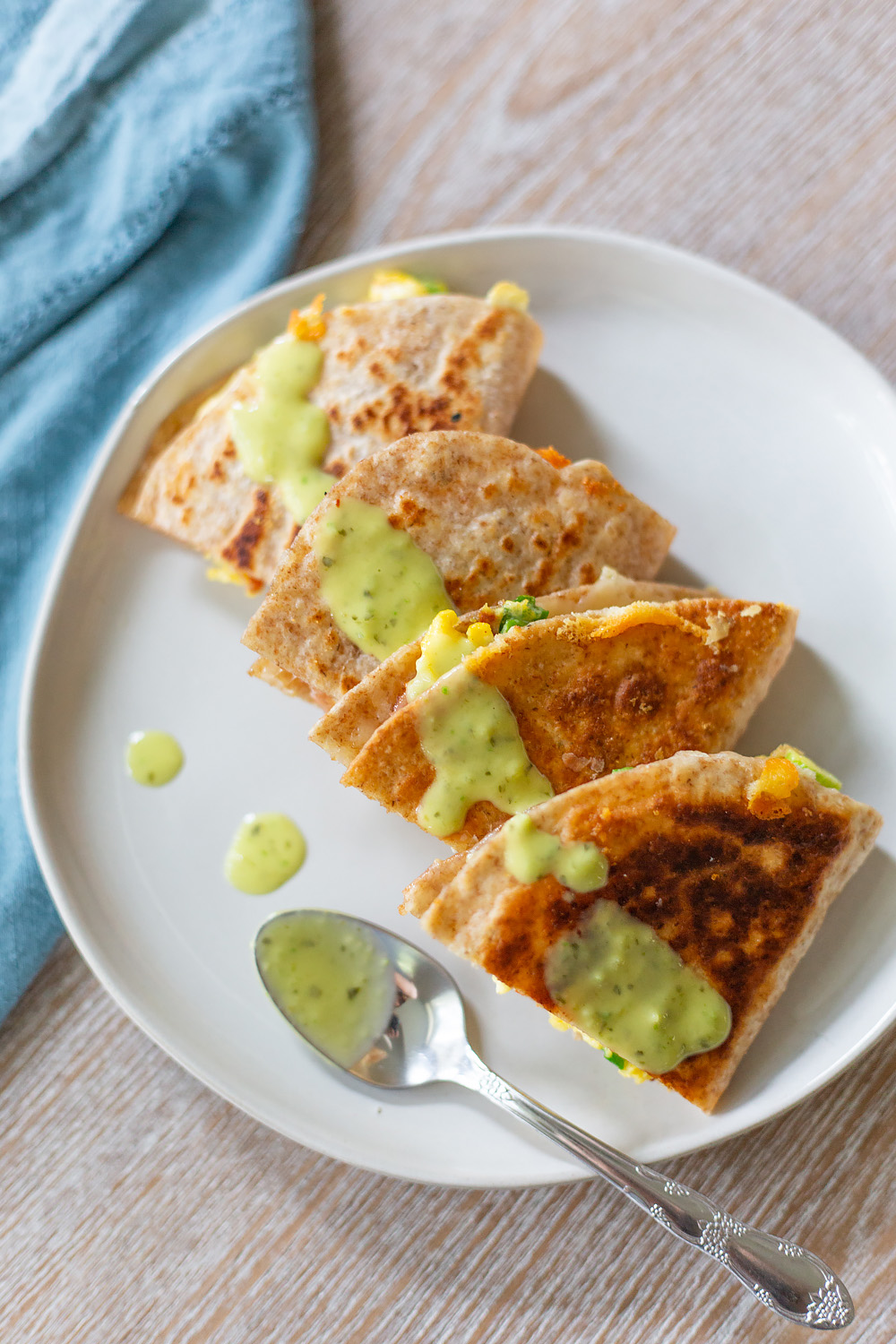 breakfast quesadilla with a spoon from above.