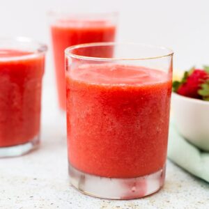 Strawberry slushies in clear glasses