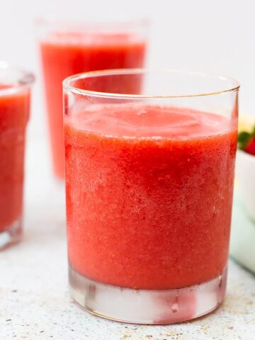 Strawberry slushies in clear glasses