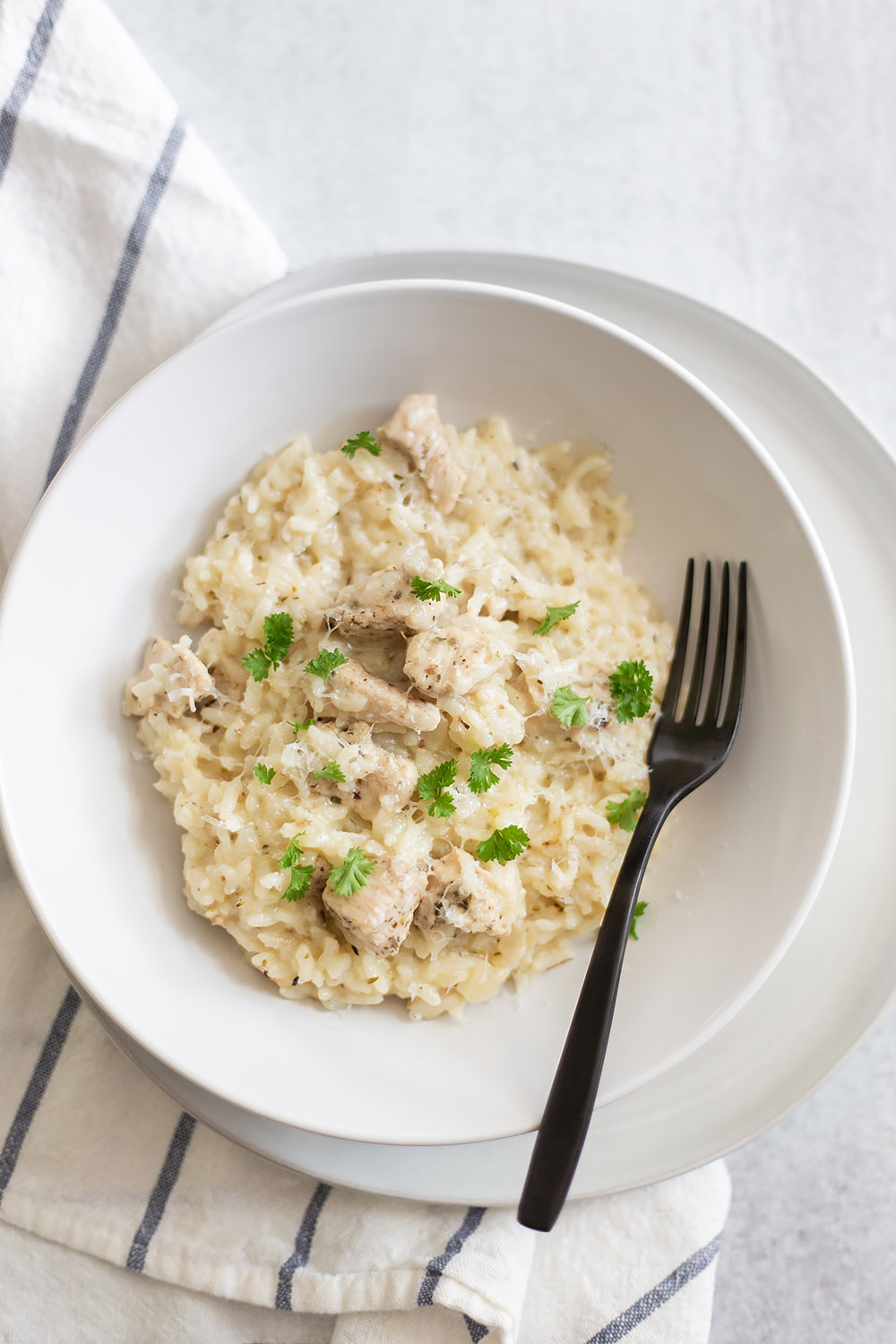 instant pot chicken risotto in a white bowl.