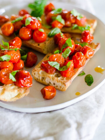 oven roasted tomatoes on toasted bread