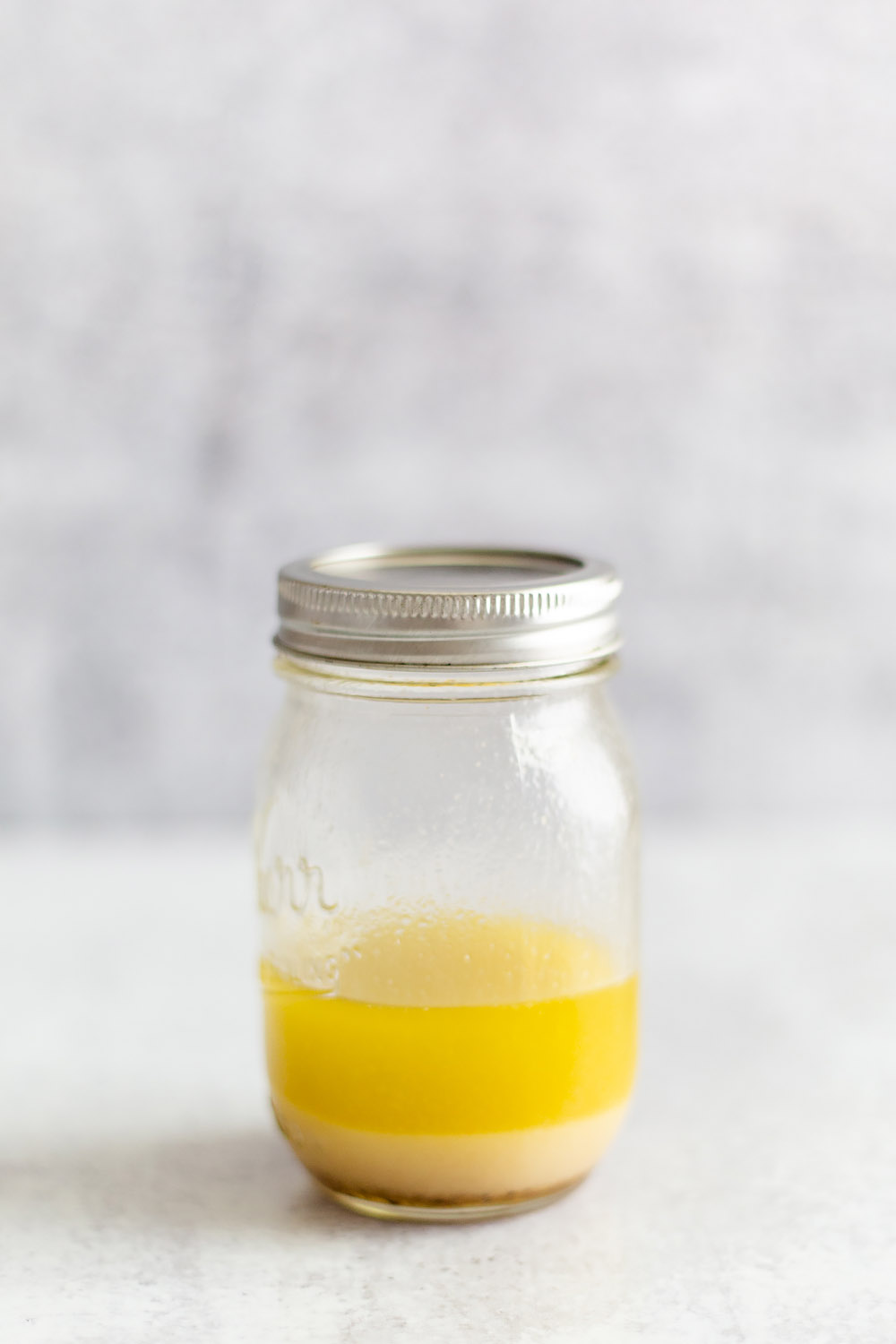 apple cider salad dressing in a jar