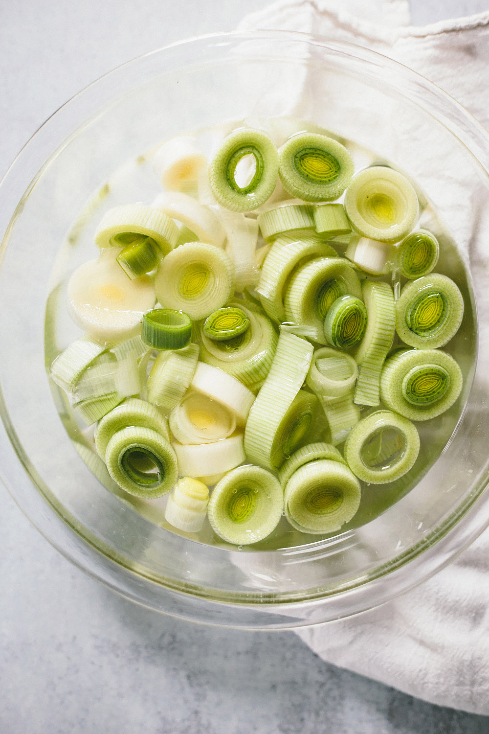 cut leeks in a bowl of water