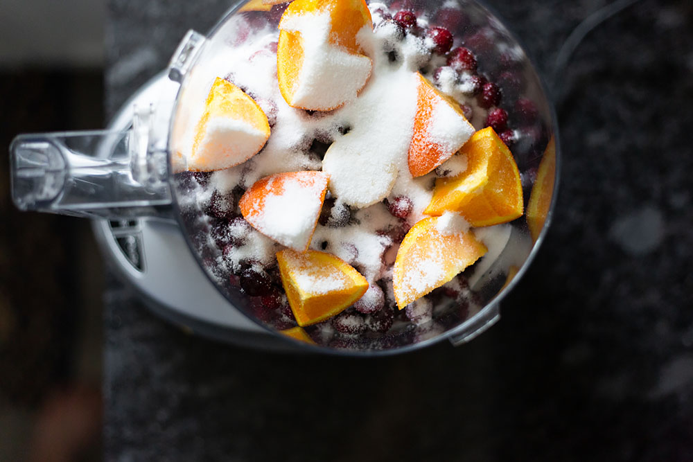 oranges, cranberries, and sugar in a food processor