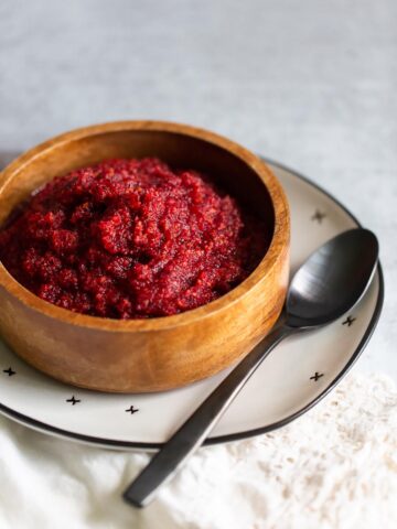 orange cranberry relish in a wooden bowl