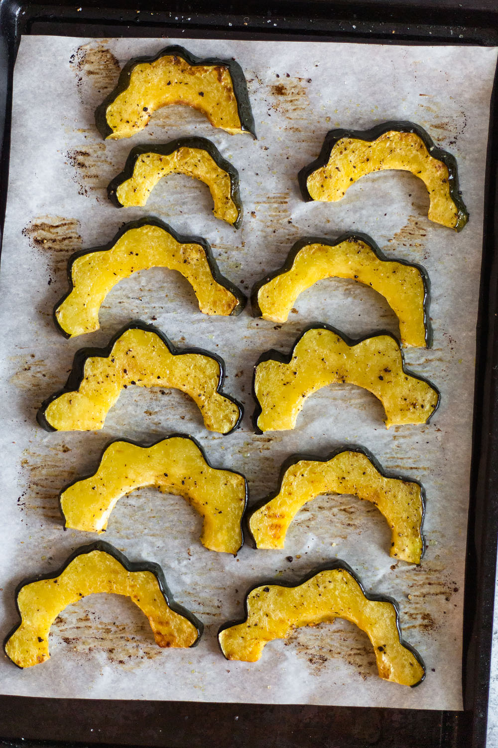 roasted acorn squash on a sheet pan