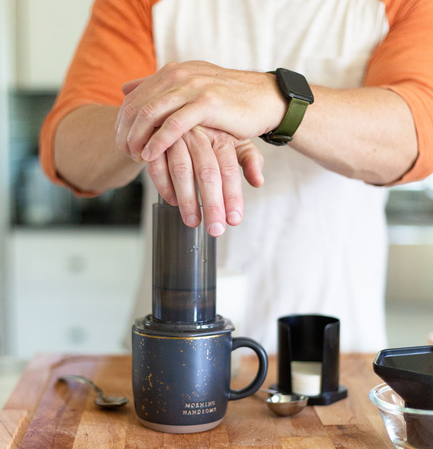 pushing down on an aeropress