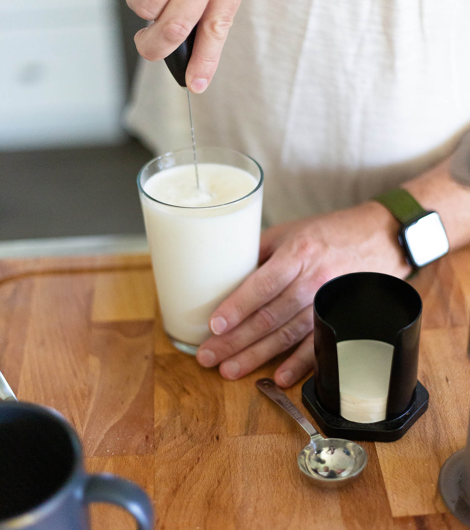 foaming milk with a handheld frother