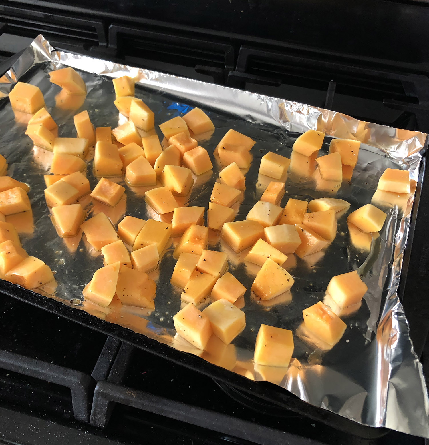 butternut squash roasting on a pan