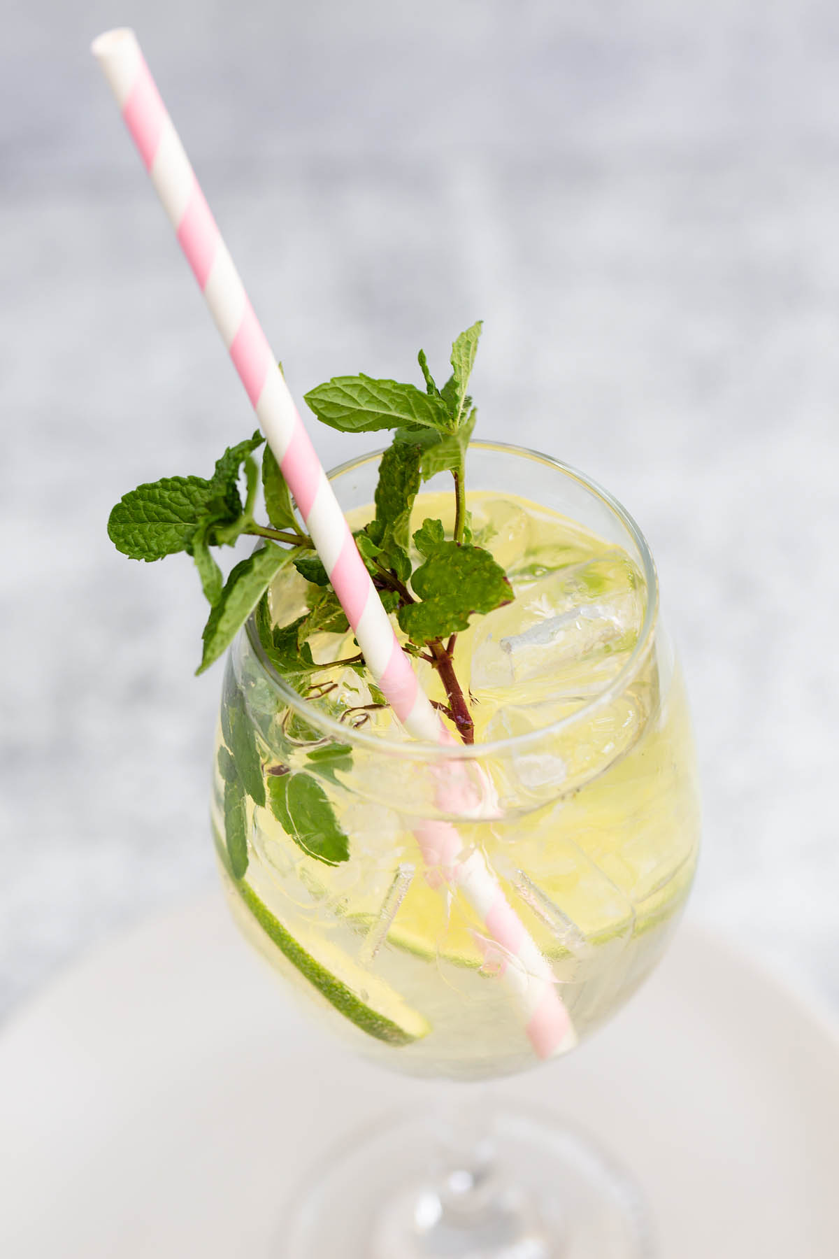 hugo spritz with a pink straw