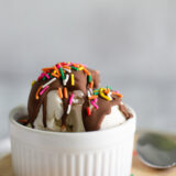 ice cream in a bowl with magic shell and sprinkles