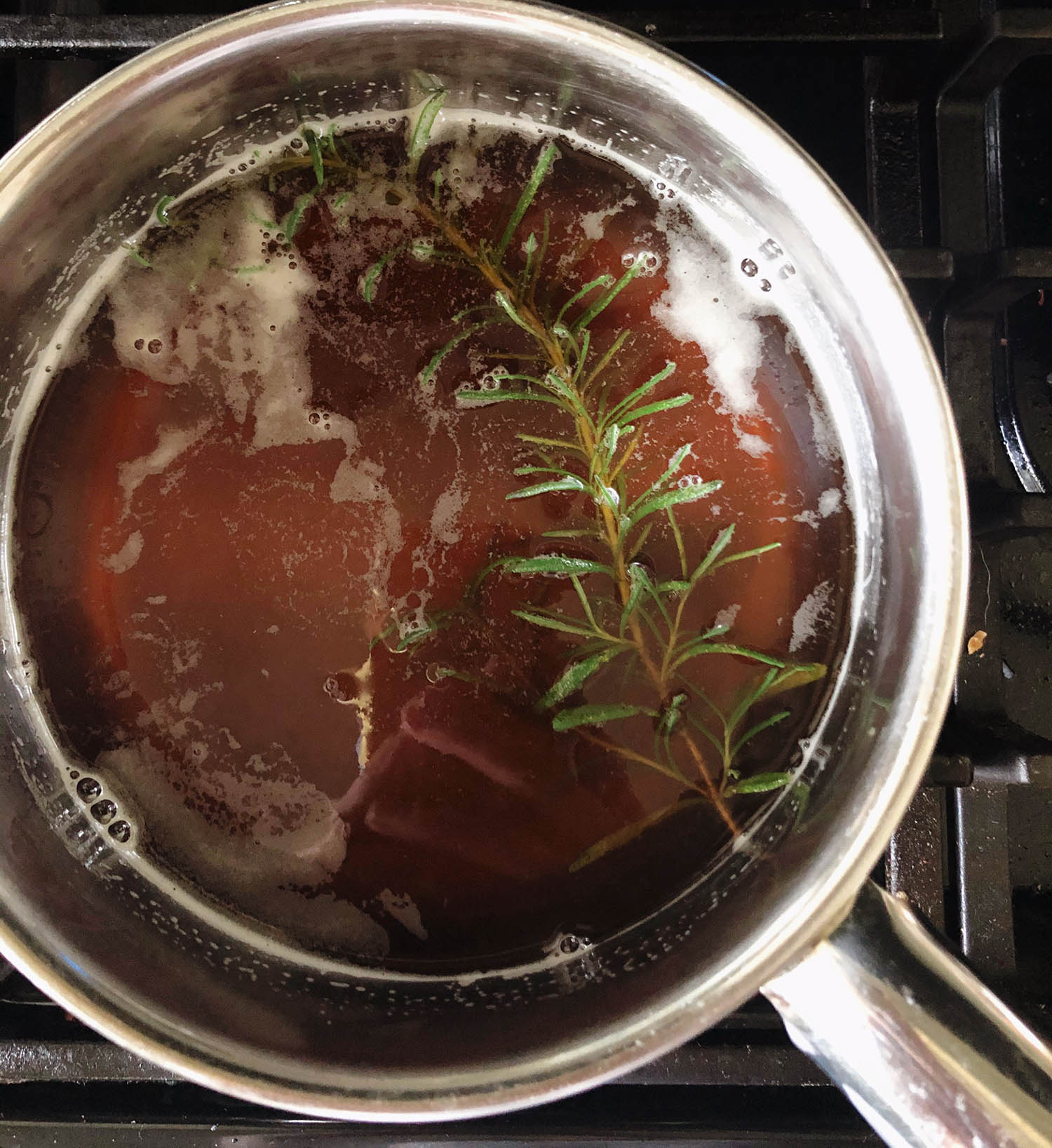 rosemary sprig in the honey syrup