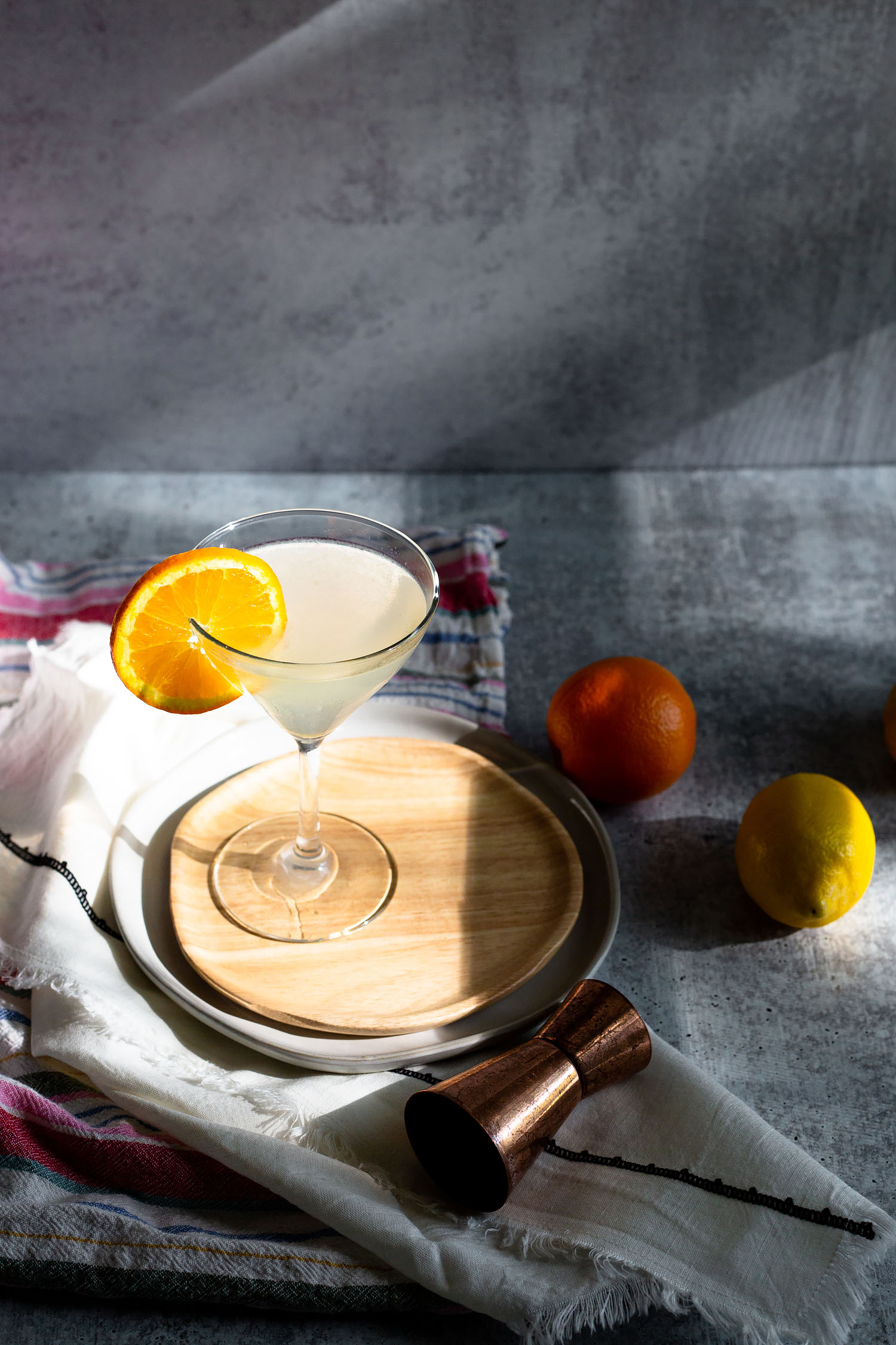 white lady cocktail with an orange slices