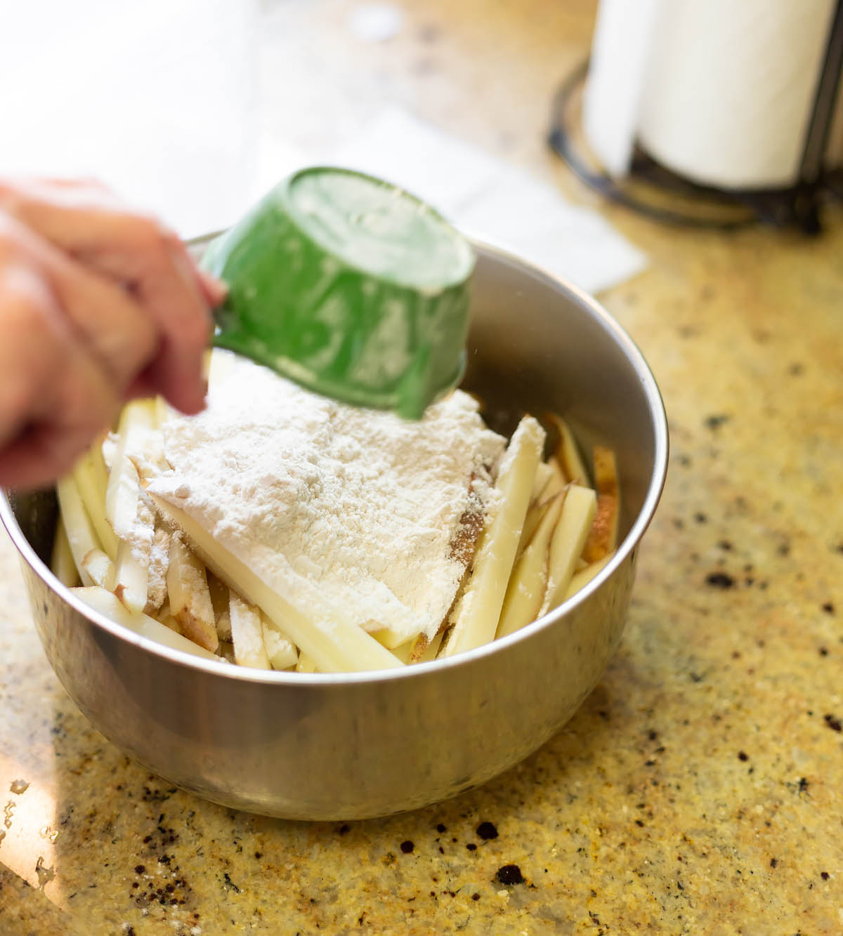 adding flour to french fries