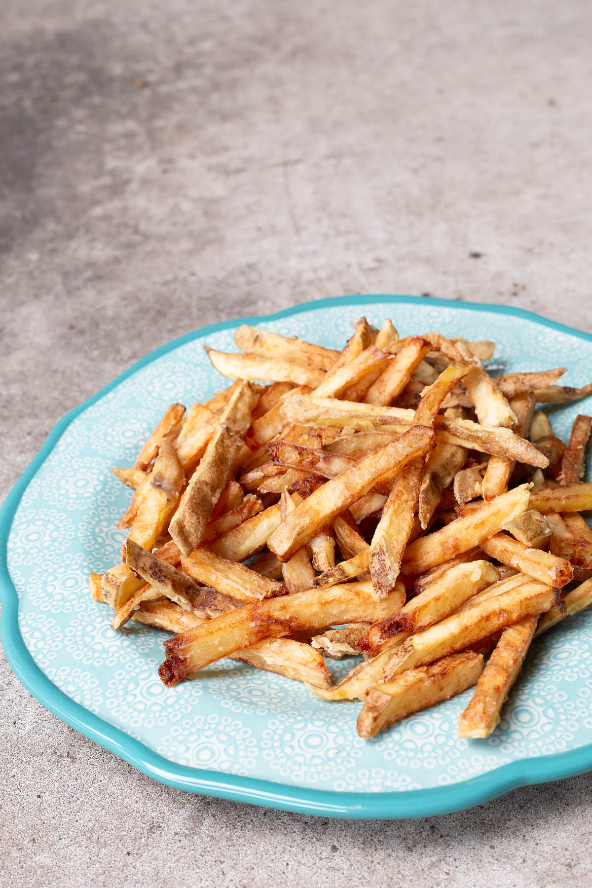 crispy battered french fries on a plate