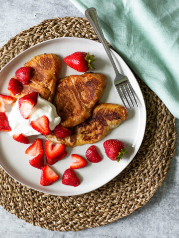 croissant french toast with strawberries and whipped cream