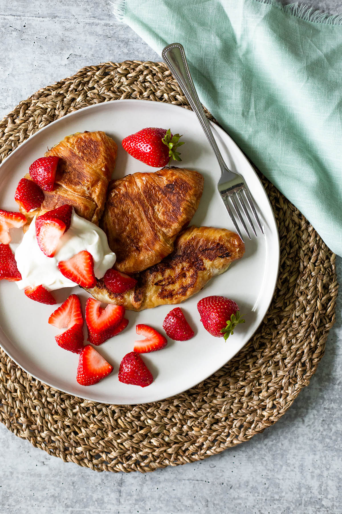 croissant french toast with strawberries and whipped cream