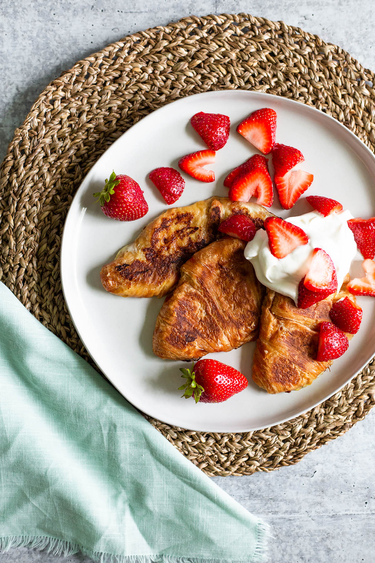croissant french toast with strawberries and whipped cream