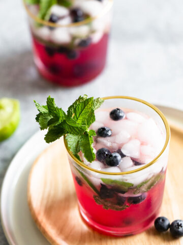 blueberry mojito mocktail with fresh blueberries and mint