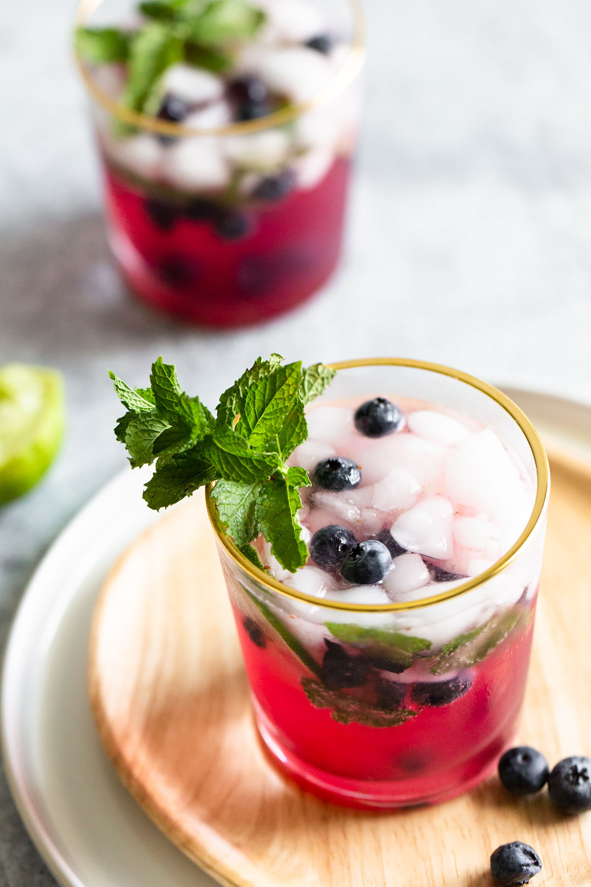 blueberry mojito mocktail with fresh blueberries and mint