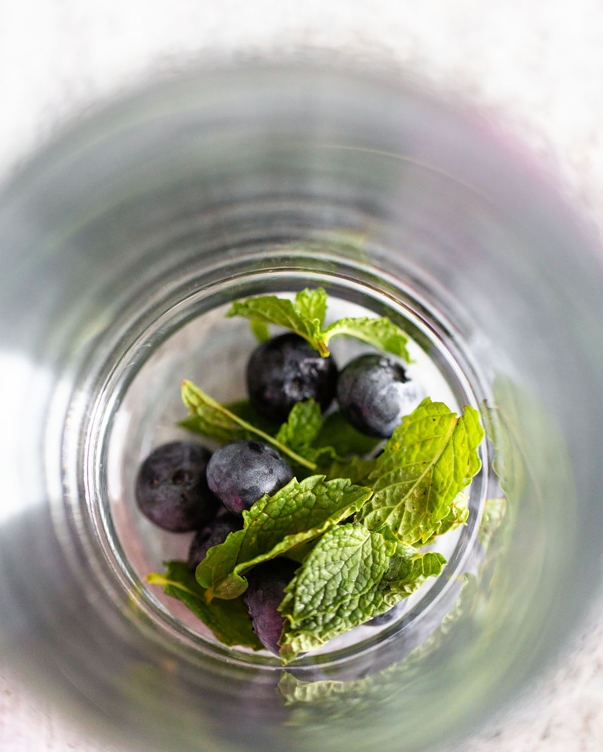 blueberries and mint in a glass