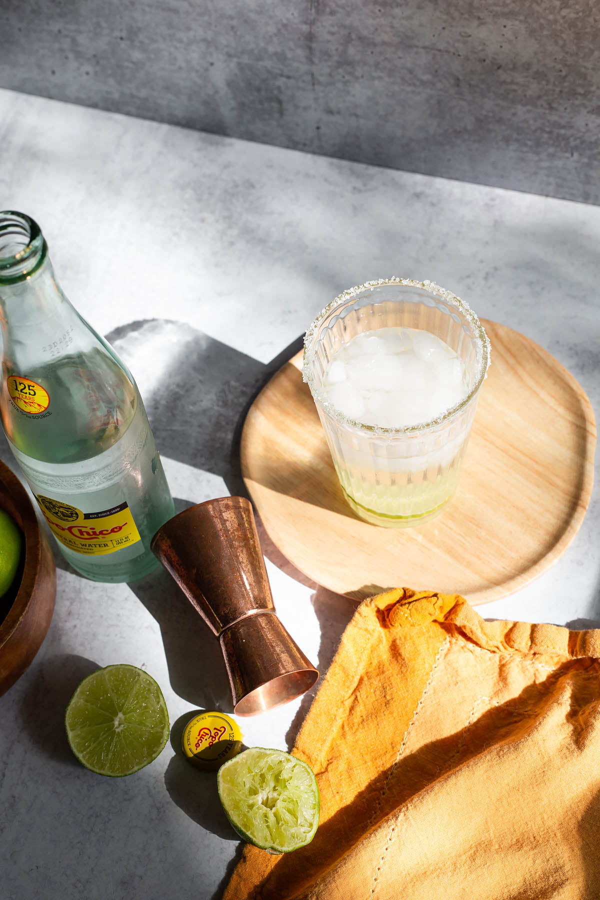 ranch water cocktail in a glass with a salt rim