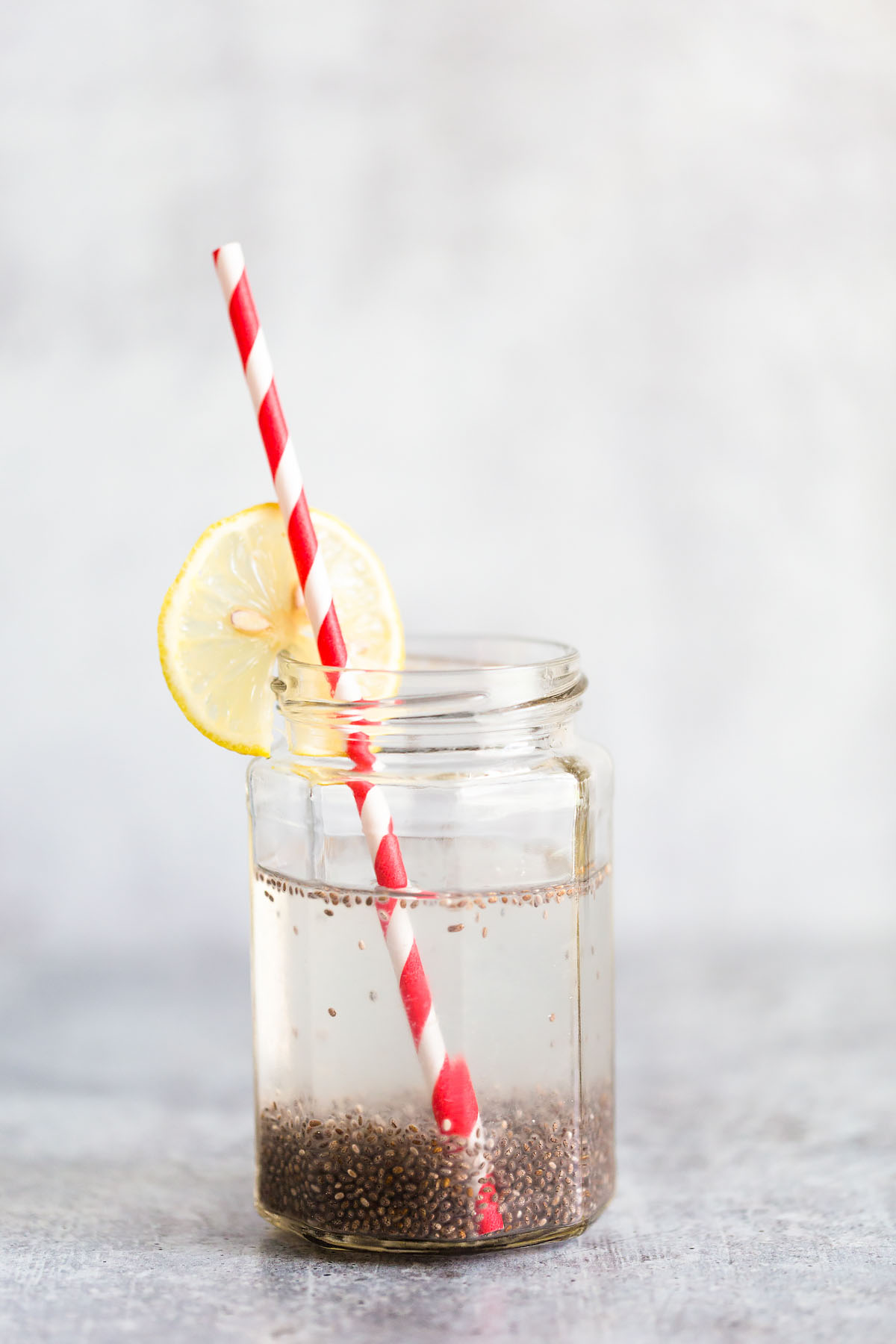 chia seed lemon water with a straw