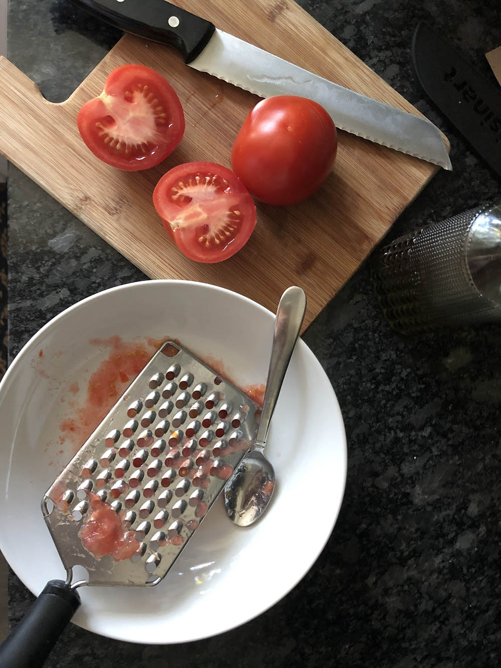 grating tomatoes for spanish tomato bread