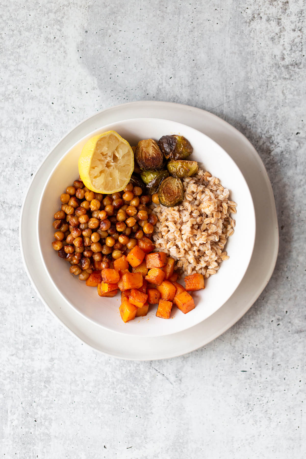 farro bowl with butternut squash chickpeas ad brussels sprouts