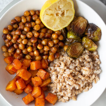 farro bowl up close with butternut squash chickpeas ad brussels sprouts