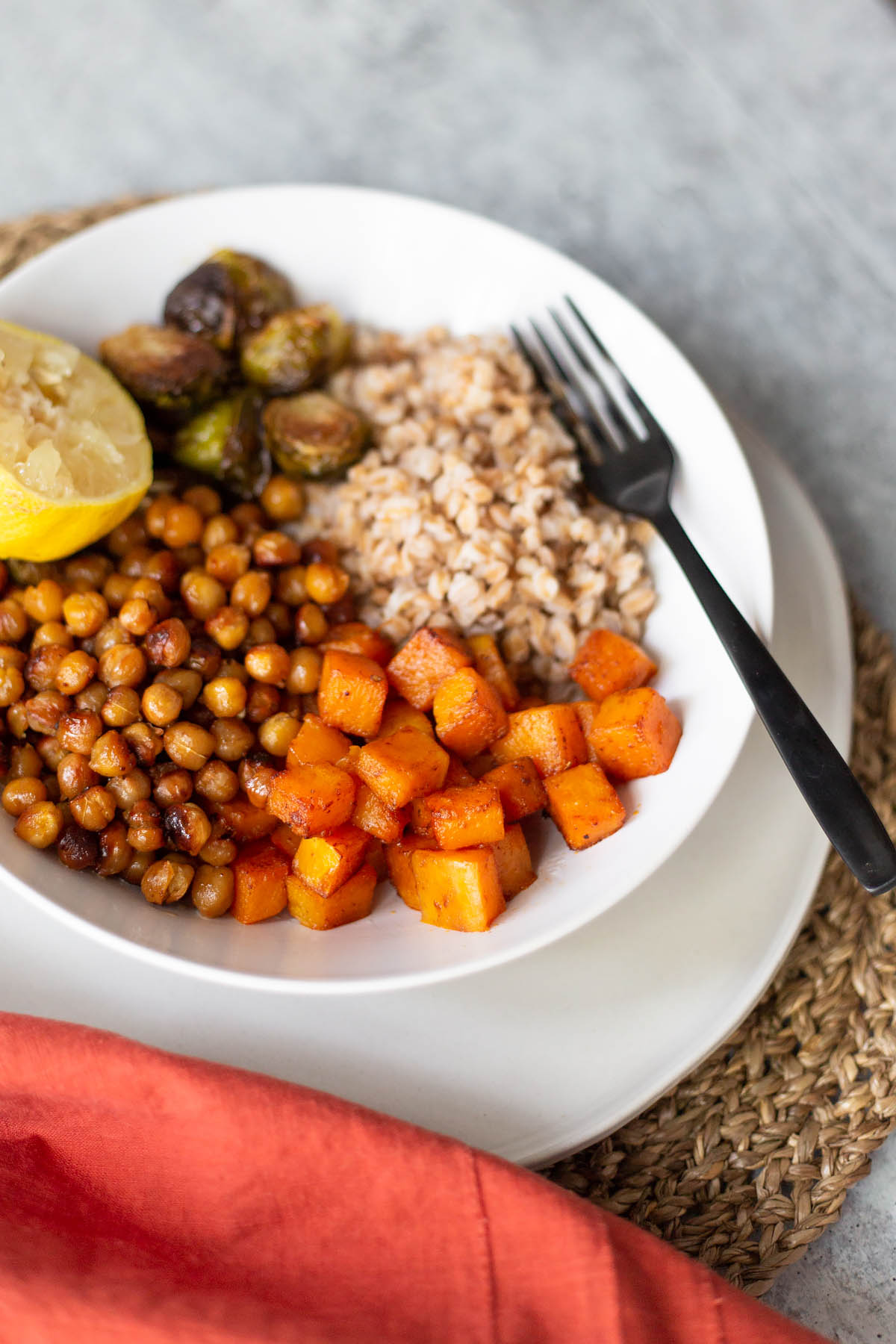 butternut squash farro bowl with a fork