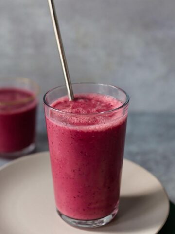 Cauliflower cherry smoothie with a straw