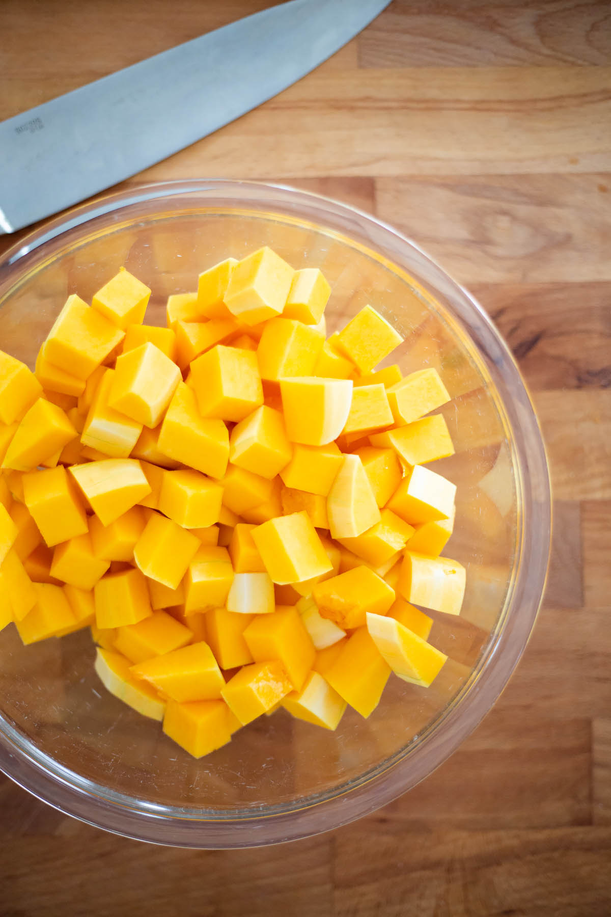 diced butternut squash in a glass bowl