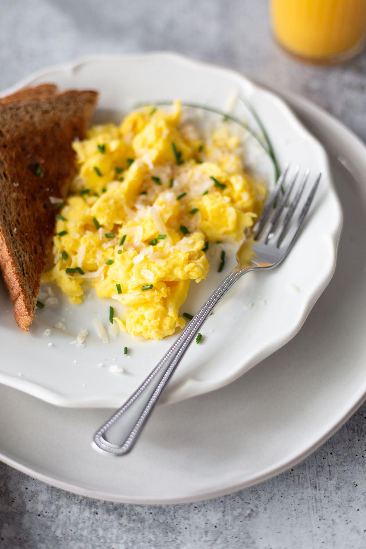 scrambled eggs and a fork on a plate