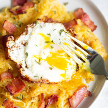 spaghetti squash carbonara with broken egg yolk