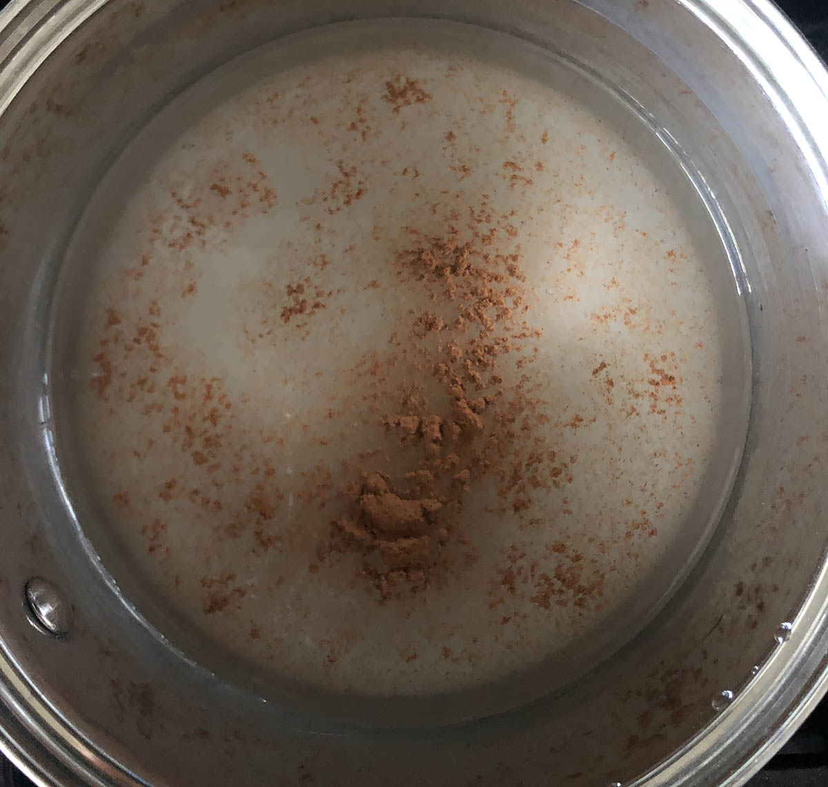 cinnamon, sugar, and water in a pot