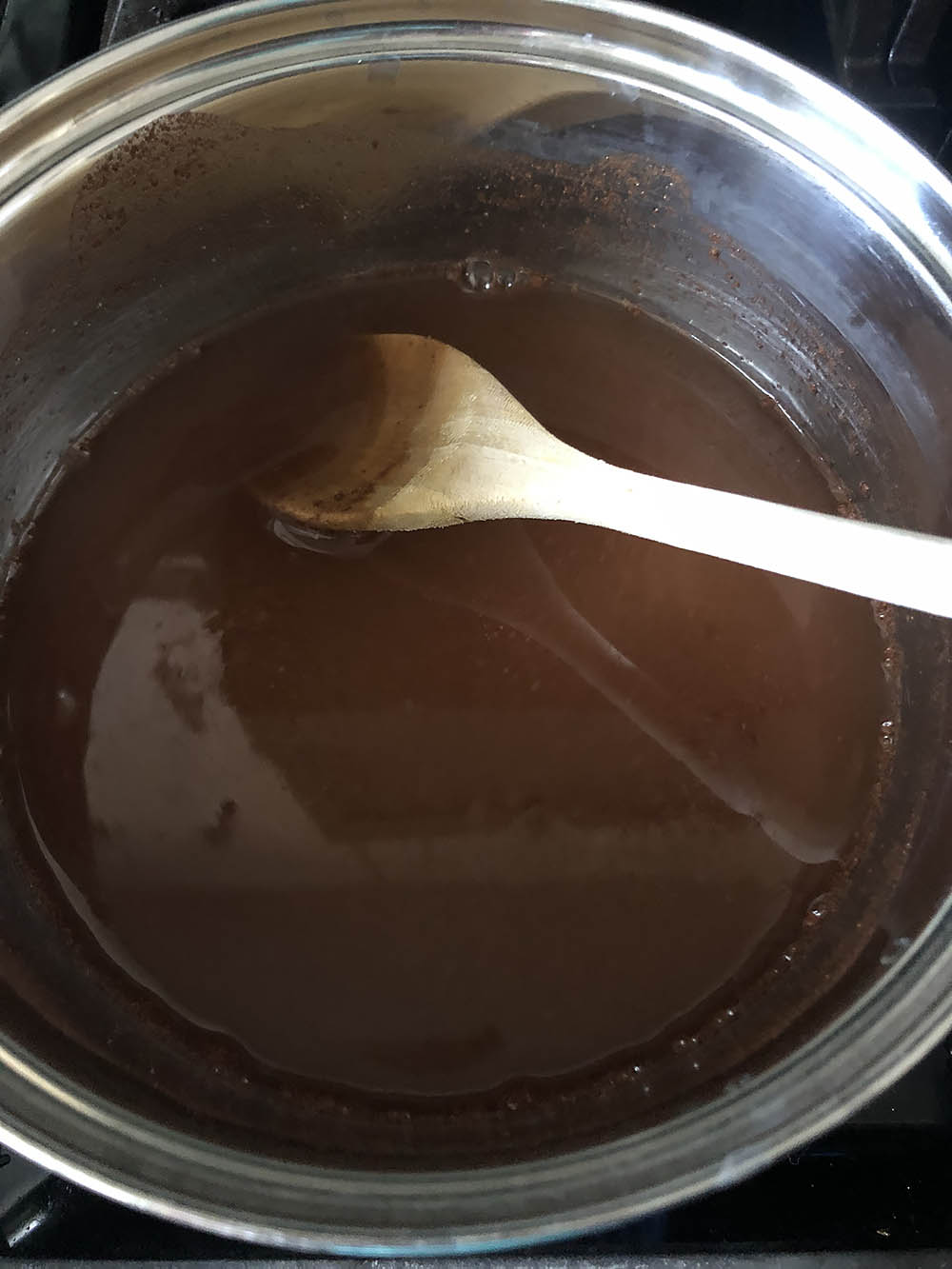 making cinnamon syrup with ground cinnamon in a pot