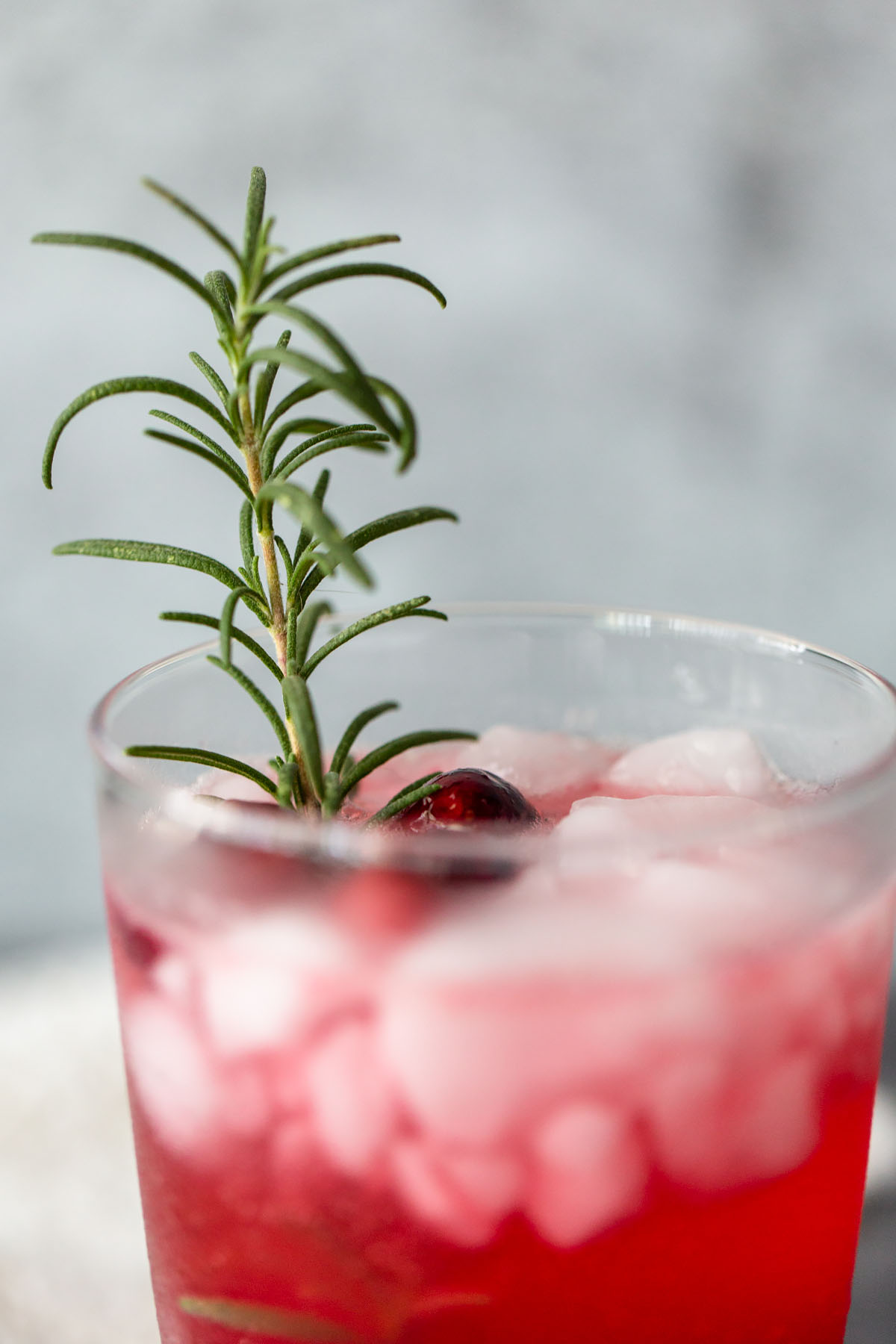 cranberry mocktail up close with rosemary
