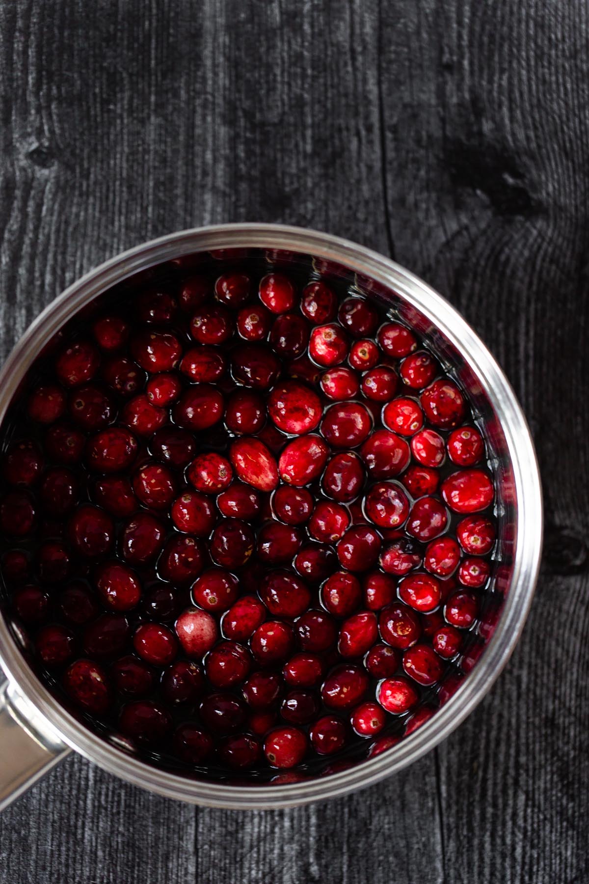 cranberries in a pot with water