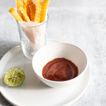 cumin lime ketchup in a bowl with fries