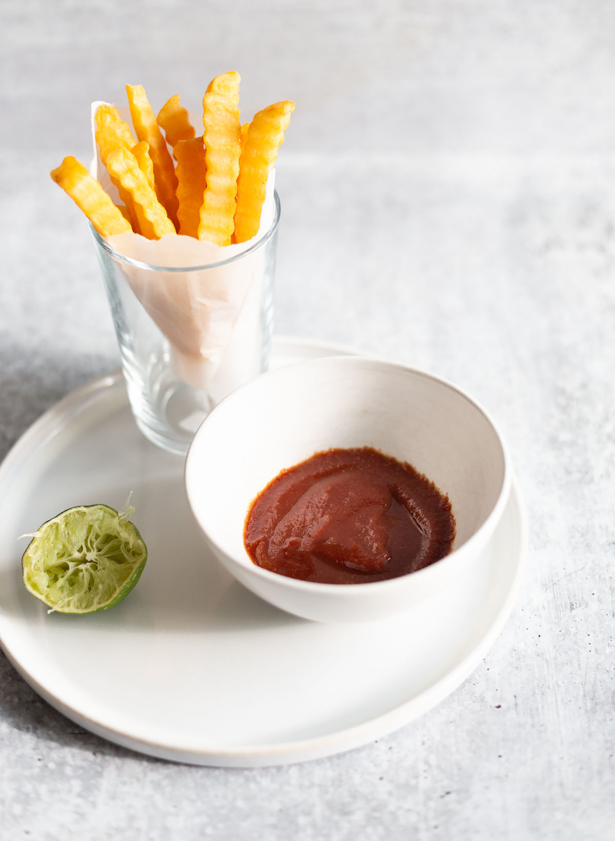 cumin lime ketchup in a bowl with fries