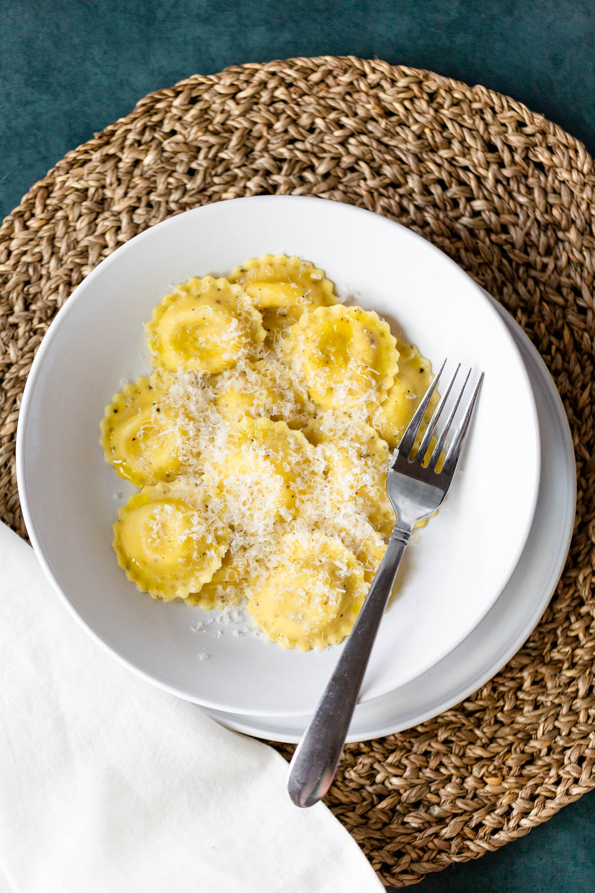 trader joes cacio e pepe cooked on a plate with parmesan cheese